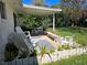 Spacious covered patio with comfortable seating, ideal for entertaining or relaxing outdoors at 2321 Tamarind Dr, Edgewater, FL 32141