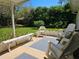Covered patio area with outdoor seating, creating a relaxing space for enjoying the backyard views at 2321 Tamarind Dr, Edgewater, FL 32141