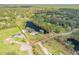 Beautiful aerial shot of property and lake outlined in red showing boundaries at 2533 Glenhaven St, New Smyrna Beach, FL 32168