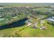 Beautiful aerial shot of property and lake outlined in red showing boundaries from other angle at 2533 Glenhaven St, New Smyrna Beach, FL 32168