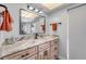 Bright bathroom featuring a large mirror, modern lighting, and a spacious vanity with storage at 2533 Glenhaven St, New Smyrna Beach, FL 32168