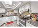 Modern kitchen with stainless steel appliances, granite countertops, and ample cabinet space at 2533 Glenhaven St, New Smyrna Beach, FL 32168