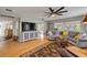 Bright living room with a cozy seating area, fireplace, and ample natural light at 2533 Glenhaven St, New Smyrna Beach, FL 32168