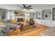 Cozy living room with a fireplace, built-in shelves, and plush seating at 2533 Glenhaven St, New Smyrna Beach, FL 32168