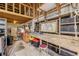 Organized workshop features a workbench, storage shelves, tools, and natural light from windows for projects at 2533 Glenhaven St, New Smyrna Beach, FL 32168