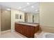 Bathroom showcasing double vanity with granite counters and a walk-in shower at 261 Minorca Beach Way # 606, New Smyrna Beach, FL 32169