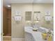 Modern bathroom with a shower and vanity, enhanced by elegant tile and neutral paint at 261 Minorca Beach Way # 606, New Smyrna Beach, FL 32169