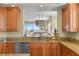 A view from the kitchen offers a glimpse into the living room and a stunning ocean view at 261 Minorca Beach Way # 606, New Smyrna Beach, FL 32169