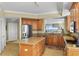 Well-appointed kitchen with granite countertops, stainless steel appliances, and a view of the ocean at 261 Minorca Beach Way # 606, New Smyrna Beach, FL 32169