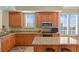 Spacious kitchen with granite countertops, stainless steel appliances, and ample cabinet space at 261 Minorca Beach Way # 606, New Smyrna Beach, FL 32169