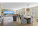Open-concept living and dining area with stunning ocean views and stylish furnishings at 261 Minorca Beach Way # 606, New Smyrna Beach, FL 32169