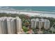 Aerial view of beachfront condos with easy access to the beach via a convenient boardwalk at 2700 N Peninsula Ave # 113, New Smyrna Beach, FL 32169