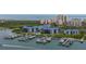 Stunning aerial shot of waterfront condos, a marina with boats, and the ocean in the background at 2700 N Peninsula Ave # 113, New Smyrna Beach, FL 32169