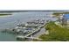 Scenic aerial view showcasing a marina filled with boats and yachts, nestled near waterfront condos at 2700 N Peninsula Ave # 113, New Smyrna Beach, FL 32169
