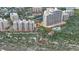 Overhead angle of condominium buildings highlighting beach access, pools, tennis courts and manicured green spaces at 2700 N Peninsula Ave # 113, New Smyrna Beach, FL 32169