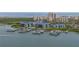 Wide aerial view of waterfront condos with docks and ocean backdrop in a coastal setting at 2700 N Peninsula Ave # 113, New Smyrna Beach, FL 32169