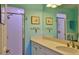 This bathroom features a single vanity with a spacious countertop and walk-in shower with frosted glass at 2700 N Peninsula Ave # 113, New Smyrna Beach, FL 32169