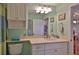 Well-lit bathroom with vanity, storage, and neutral tones, blending style and functionality at 2700 N Peninsula Ave # 113, New Smyrna Beach, FL 32169