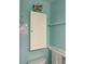Bathroom showing a cabinet and a carousel horse statue on top, a grab bar, and a towel rack at 2700 N Peninsula Ave # 113, New Smyrna Beach, FL 32169