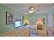 Bright bedroom with twin beds and soft, inviting decor, creating a comfortable retreat at 2700 N Peninsula Ave # 113, New Smyrna Beach, FL 32169