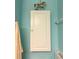 Bathroom storage cabinet with a carousel horse figurine and towel rack at 2700 N Peninsula Ave # 113, New Smyrna Beach, FL 32169
