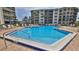 Large community pool in a well-maintained community at 2700 N Peninsula Ave # 113, New Smyrna Beach, FL 32169