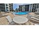 Relax by the community pool with plenty of chairs at 2700 N Peninsula Ave # 113, New Smyrna Beach, FL 32169
