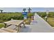 Picturesque dock featuring a wooden picnic table with waterfront views perfect for enjoying serene moments at 2700 N Peninsula Ave # 113, New Smyrna Beach, FL 32169