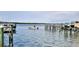 Scenic view of the community dock, with a boat out on the water and clear skies overhead at 2700 N Peninsula Ave # 113, New Smyrna Beach, FL 32169
