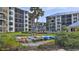 Exterior view of the condo buildings with kayaks and beach access at 2700 N Peninsula Ave # 113, New Smyrna Beach, FL 32169