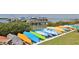 Storage rack with colorful kayaks, near the community dock at 2700 N Peninsula Ave # 113, New Smyrna Beach, FL 32169