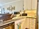 Kitchen featuring granite countertops, stainless steel appliances, and updated cabinets at 2700 N Peninsula Ave # 113, New Smyrna Beach, FL 32169