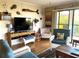 Comfortable living room with wicker furniture and outdoor views at 2700 N Peninsula Ave # 113, New Smyrna Beach, FL 32169