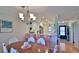 Dining area leading to kitchen with bar stool seating and updated appliances at 2700 N Peninsula Ave # 113, New Smyrna Beach, FL 32169