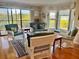 Bright living room featuring wicker furniture, hardwood floors, and a view of the outside at 2700 N Peninsula Ave # 113, New Smyrna Beach, FL 32169