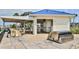 An outdoor kitchen and dining area, great for grilling and relaxing by the water at 2700 N Peninsula Ave # 113, New Smyrna Beach, FL 32169