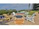 Lounge area with fire pit surrounded by chairs, near the boats at 2700 N Peninsula Ave # 113, New Smyrna Beach, FL 32169