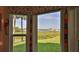 Enjoy picturesque views from this window, overlooking the lush greenery and tranquil harbor at 2700 N Peninsula Ave # 113, New Smyrna Beach, FL 32169