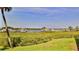 Expansive water view showcasing lush greenery and boats docked at the harbor on a sunny day at 2700 N Peninsula Ave # 113, New Smyrna Beach, FL 32169