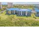 Aerial view of a condo complex with beautiful landscaping and coastal charm at 2700 N Peninsula Ave # 513, New Smyrna Beach, FL 32169