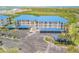 Breathtaking aerial view showcasing the condo complex, parking, landscaping, and waterfront at 2700 N Peninsula Ave # 513, New Smyrna Beach, FL 32169