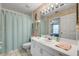 Bathroom featuring a shower curtain and large vanity with ample counter space at 2700 N Peninsula Ave # 513, New Smyrna Beach, FL 32169