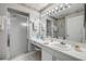 Well-lit bathroom featuring a walk-in shower and a large vanity with ample counter space at 2700 N Peninsula Ave # 513, New Smyrna Beach, FL 32169