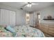 Bedroom with wood floors and ensuite bathroom, plus ample closet space at 2700 N Peninsula Ave # 513, New Smyrna Beach, FL 32169