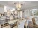 Dining room with wood flooring and a mirrored wall, open to the kitchen and bar at 2700 N Peninsula Ave # 513, New Smyrna Beach, FL 32169