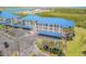 Beautiful three-story condo complex features a blue metal roof, covered parking, and waterfront views at 2700 N Peninsula Ave # 513, New Smyrna Beach, FL 32169
