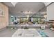 Spacious kitchen with double bowl sink and view into the living area at 2700 N Peninsula Ave # 513, New Smyrna Beach, FL 32169