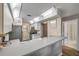 Well-lit kitchen with modern appliances and a view into the hall and bathroom at 2700 N Peninsula Ave # 513, New Smyrna Beach, FL 32169