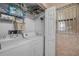 Functional laundry room with washer, dryer, and ample storage space at 2700 N Peninsula Ave # 513, New Smyrna Beach, FL 32169