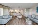 Bright, open-concept living and dining area with hardwood floors and neutral décor at 2700 N Peninsula Ave # 513, New Smyrna Beach, FL 32169